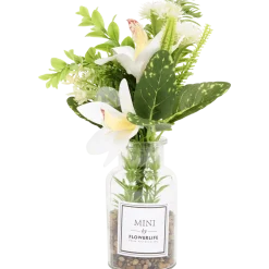 Kunstbloemen in glazen fles